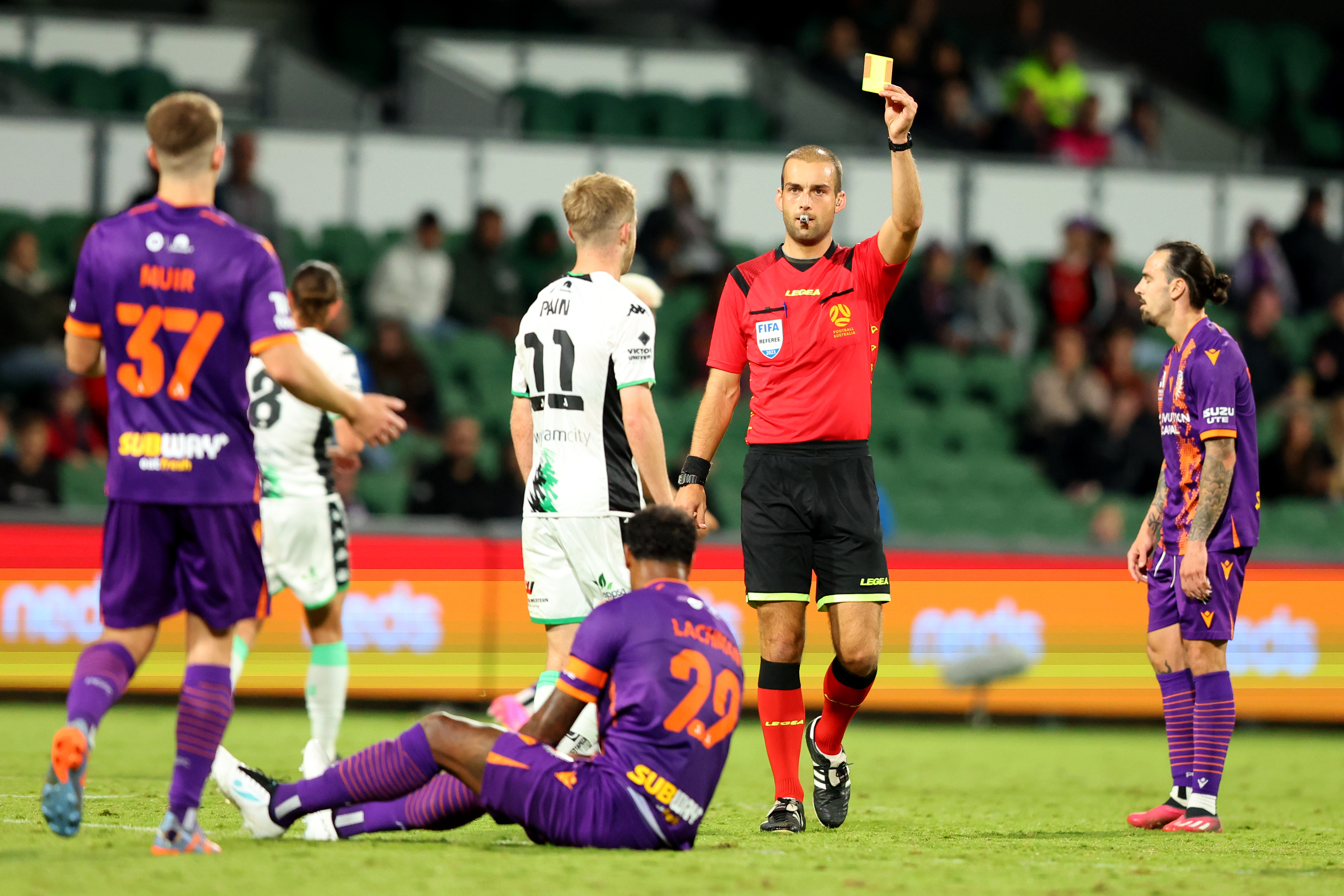 Referee Daniel Elder hands out a yellow card during the round 26 A-League Men's match between Perth Glory and Western United at HBF Park, on April 29, 2023, in Perth, Australia. (Photo by James Worsfold/Getty Images)
