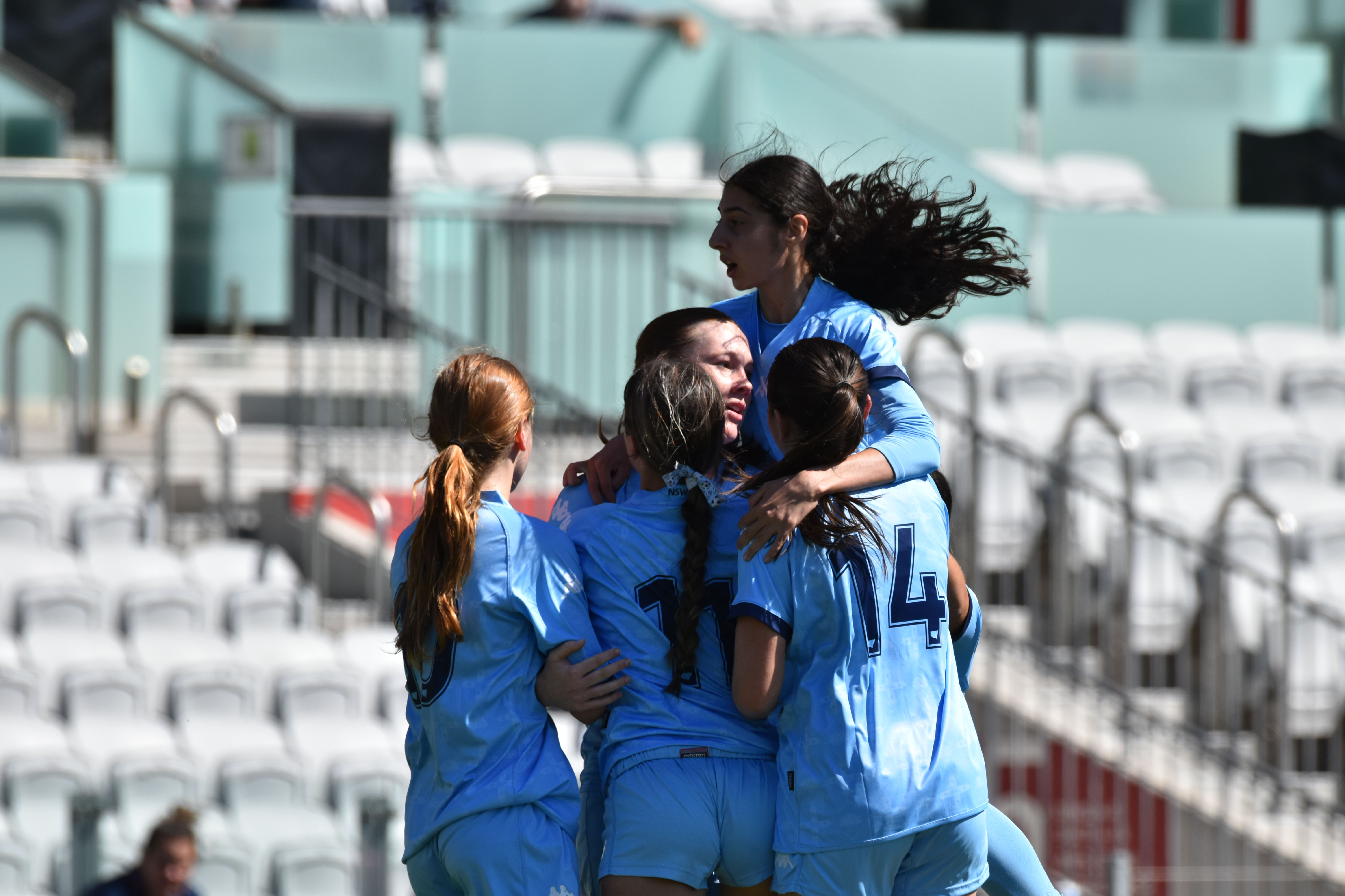 The NSW Metro side celebrate a goal against Victoria in the Under 16 Pool A match during the National Youth Championships 2023 Girls' Tournament Day at WIN Stadium.